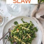 Kale apple slaw on a plate with two forks.