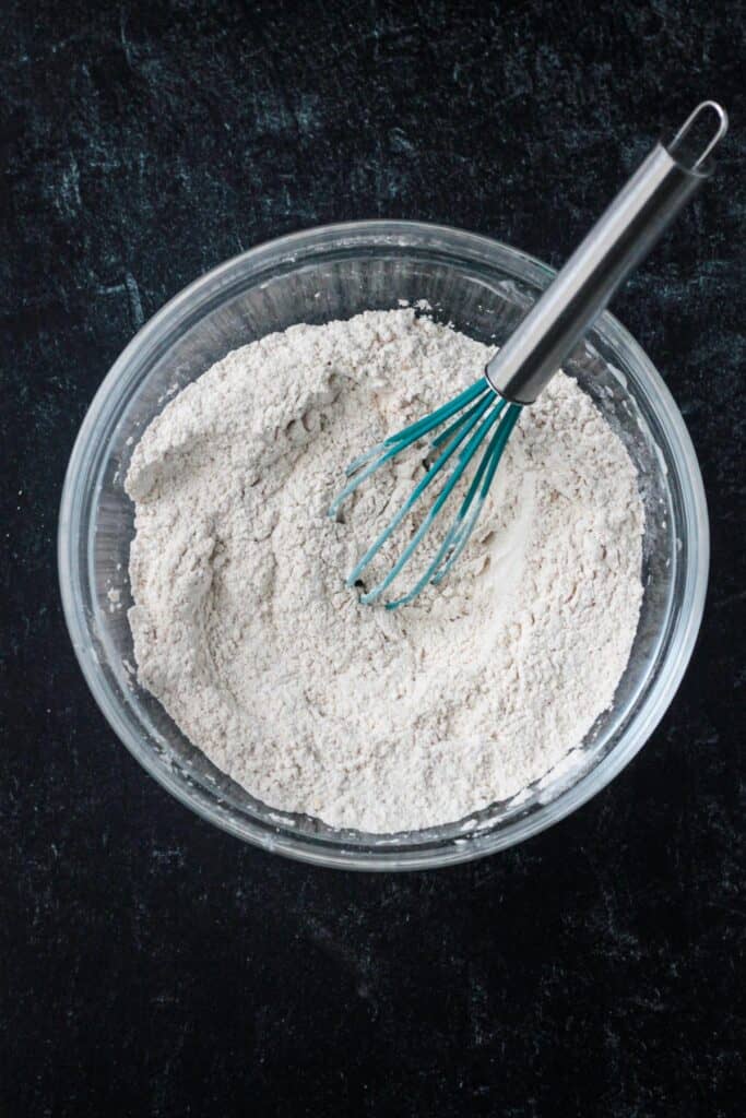 Dry ingredients whisked together in a mixing bowl.