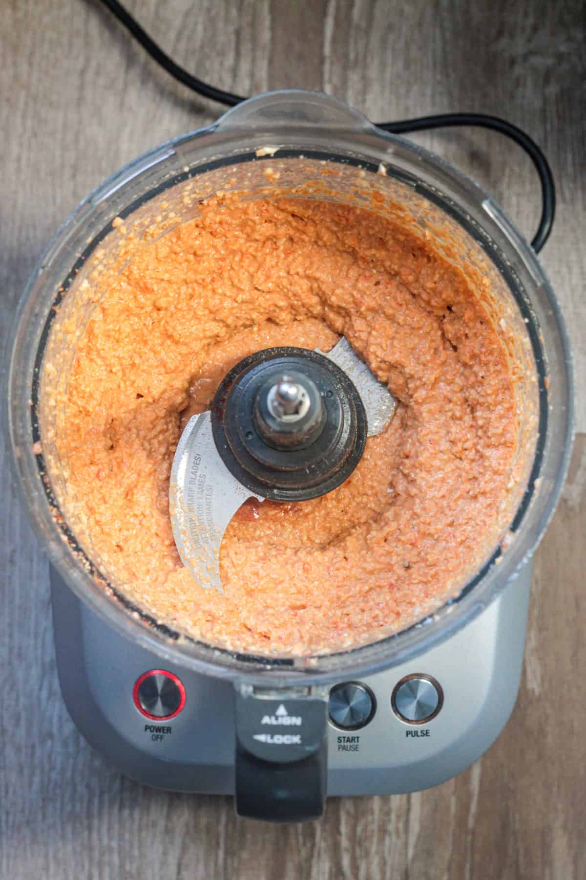 Ingredients partly blended in a food processor revealing a chunky texture.