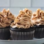 Close up of peanut butter frosting piped on a chocolate cupcake.