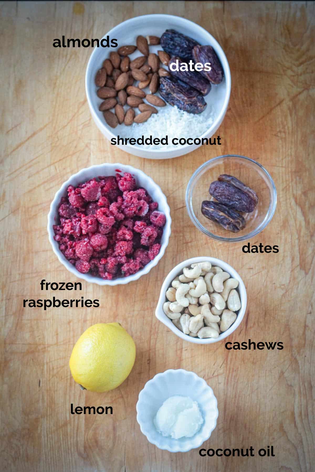 Vegan Raw Cheesecake recipe ingredients arrayed in individual bowls.