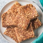 Pile of oat bars on a plate.