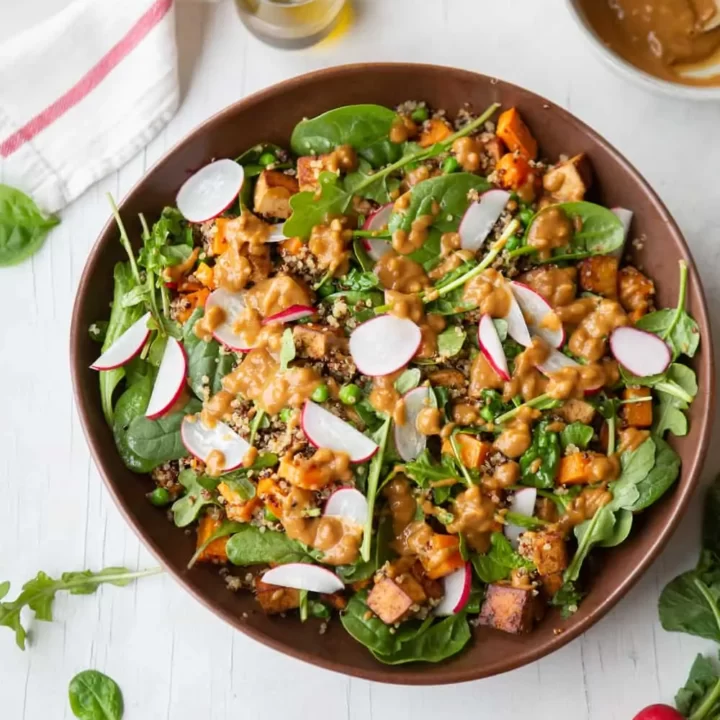 High-protein vegan dinner salad featuring quinoa, tofu and sweet potato.