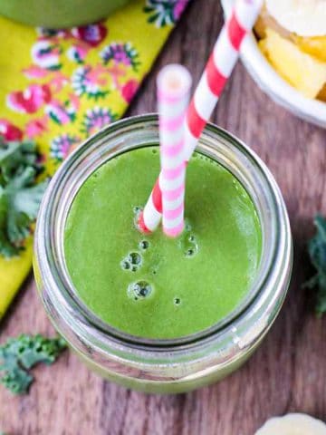 Overhead view of a pineapple spinach green smoothie.