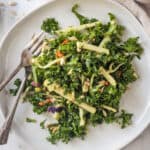 Kale Apple Slaw on a plate with two forks.