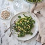 Kale Apple Slaw on a plate with two forks.