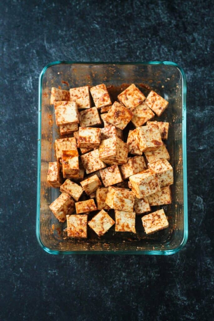 Tofu cubes mixed in marinade.