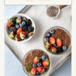 Three bowls of chia pudding with fresh berries on top.