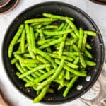 Sautéed garlic green beans in a skillet.