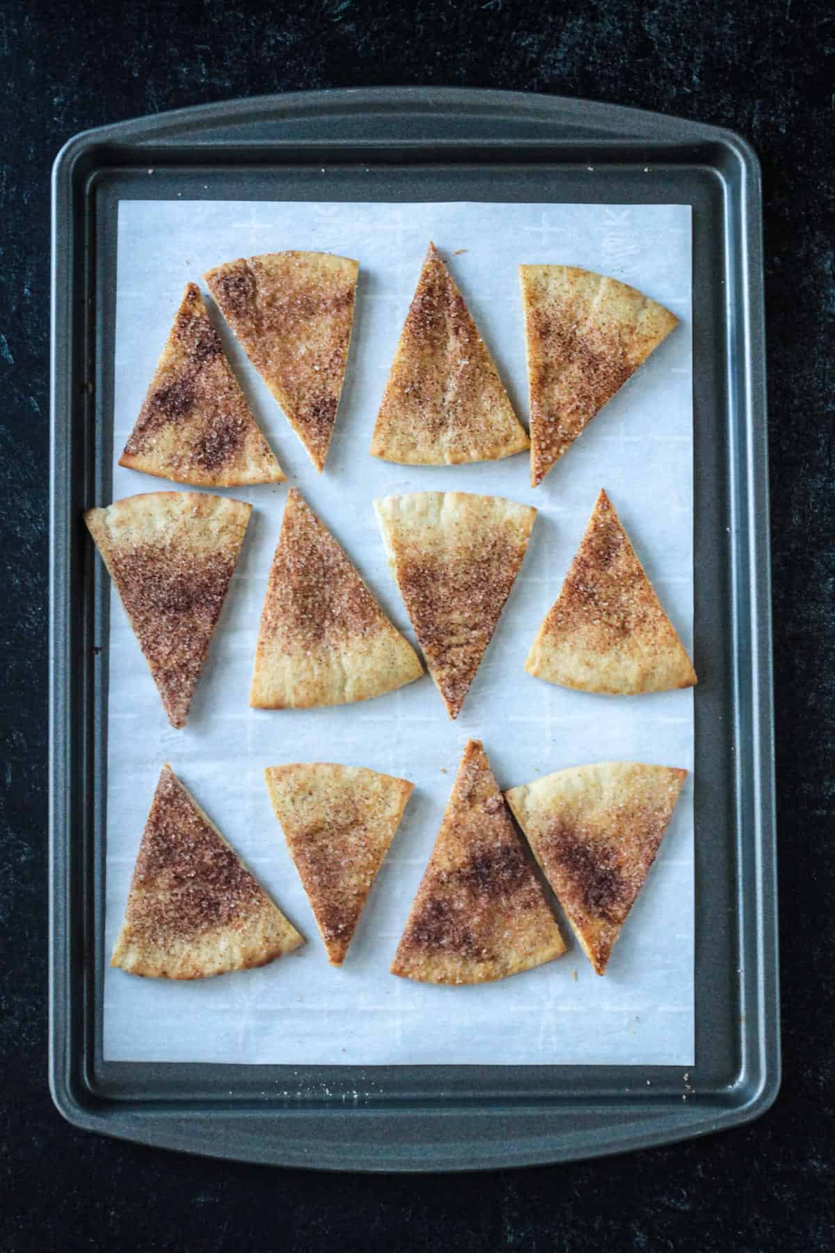 Baked chips on a baking sheet.