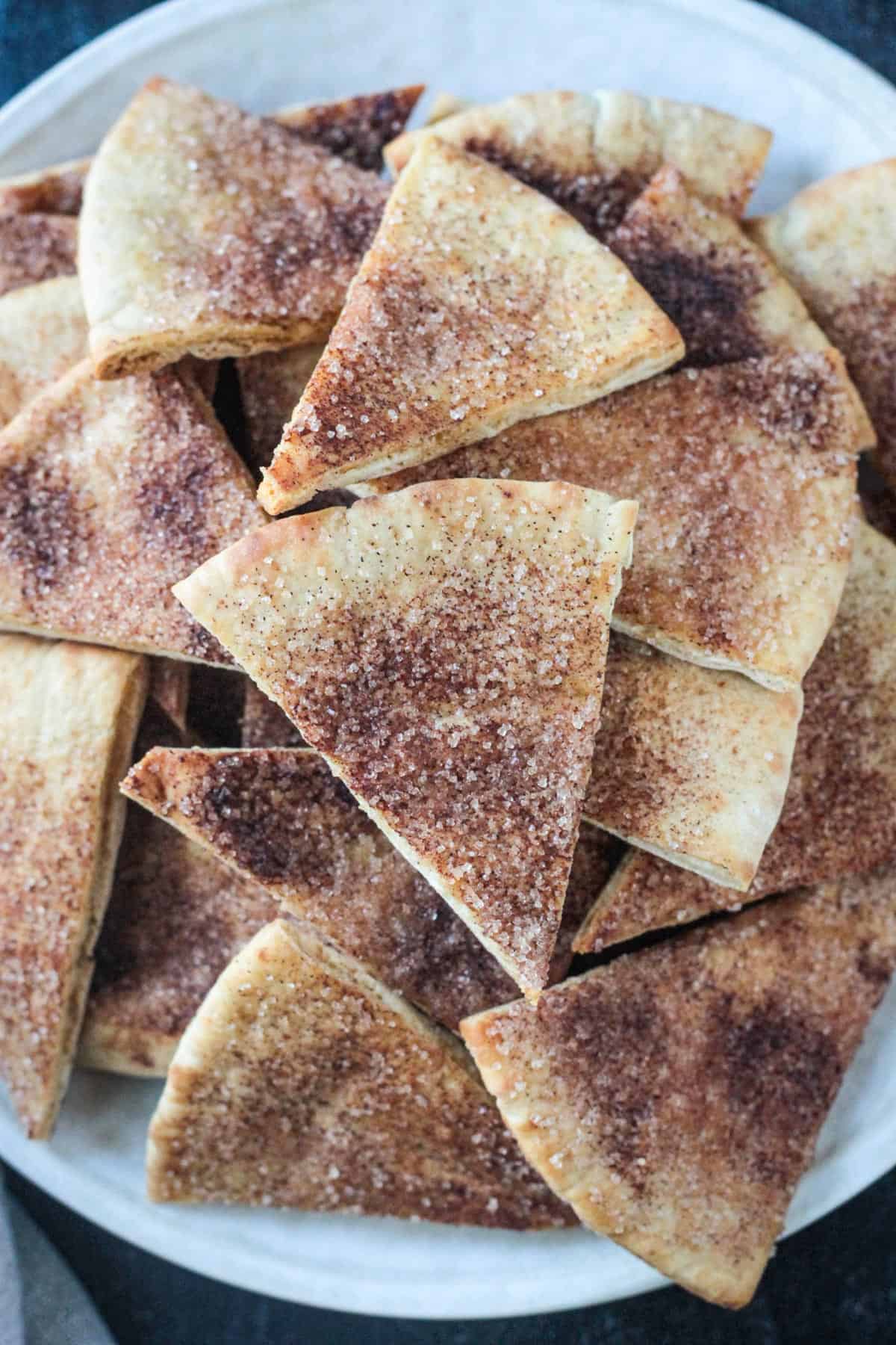 Close up of cinnamon sugar topping on a pita chip.