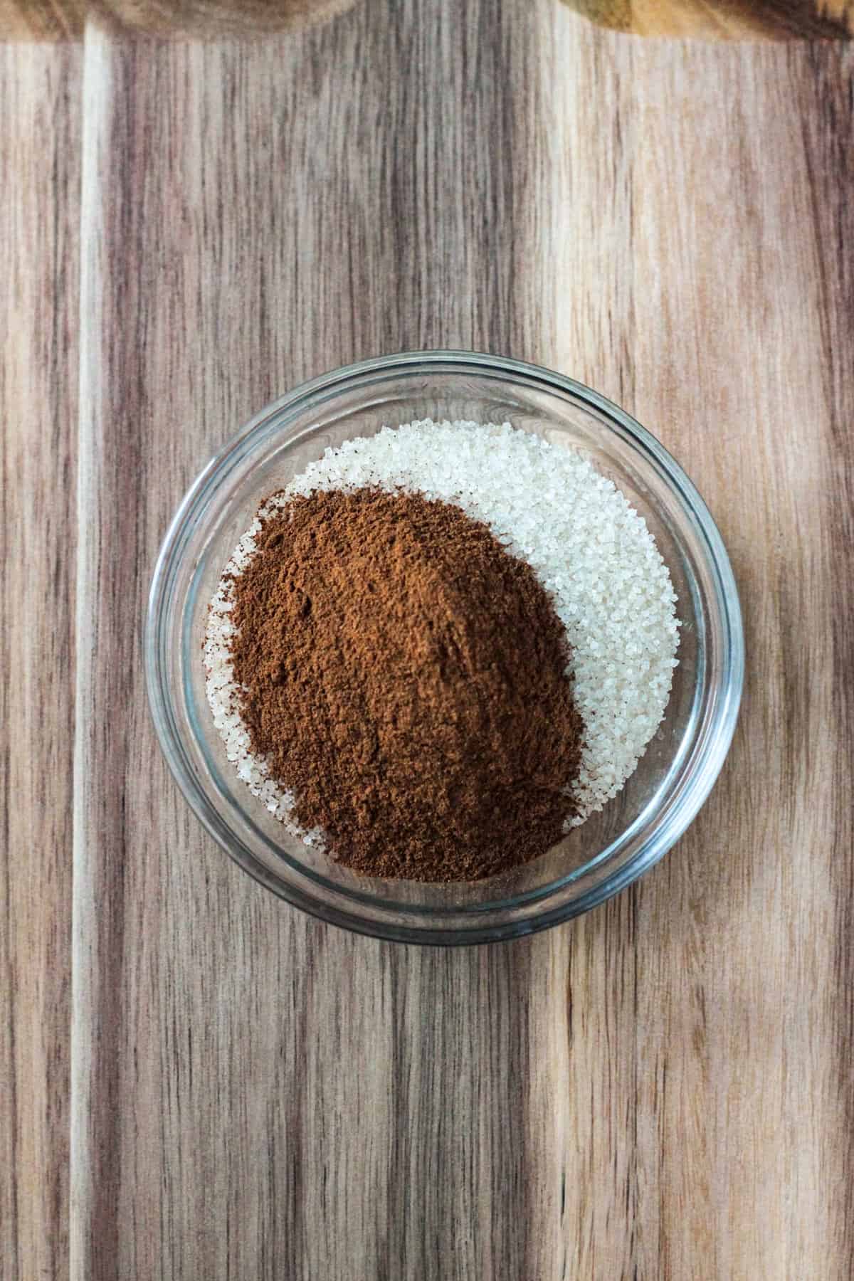 Ground cinnamon and sugar in a bowl.