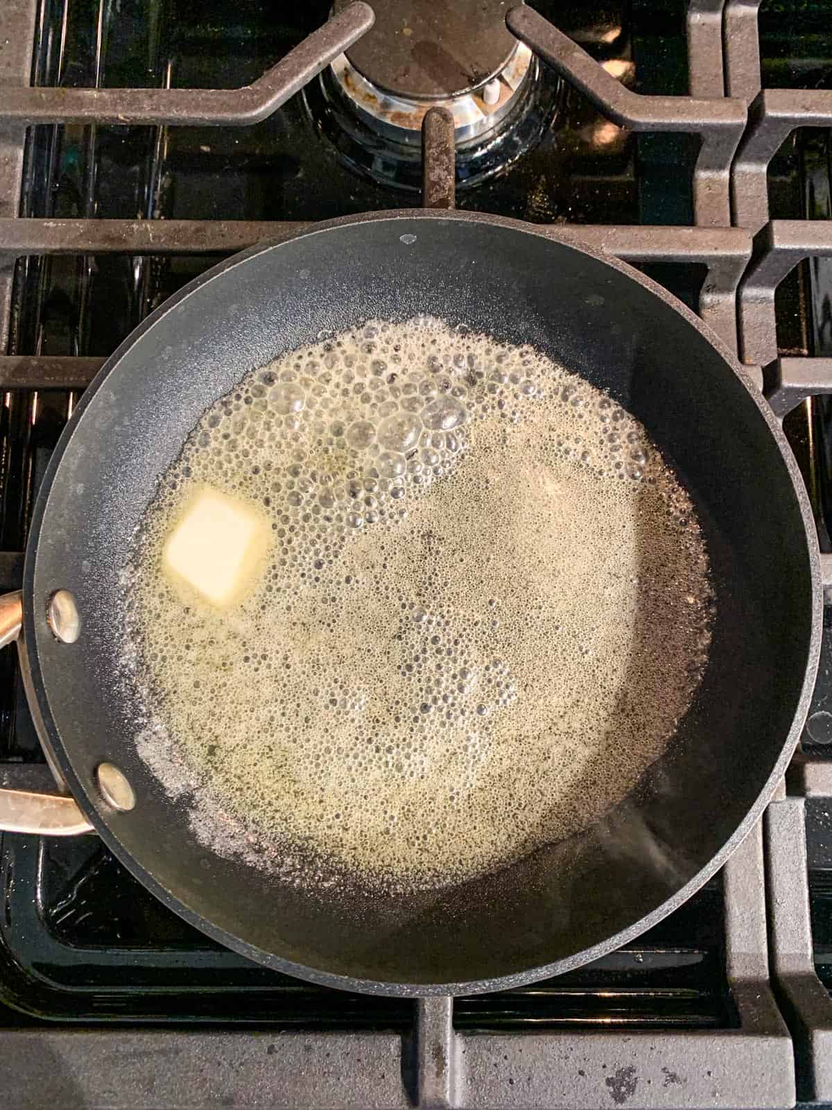 Melted butter in a skillet.