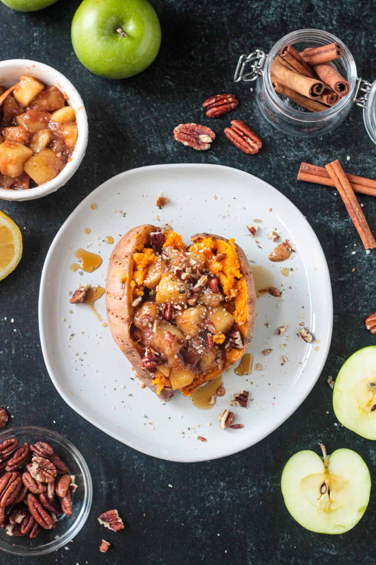 Saucy cinnamon apples on top of a stuffed sweet potato.