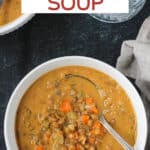 Overhead view of a bowl of curried carrot lentil soup.