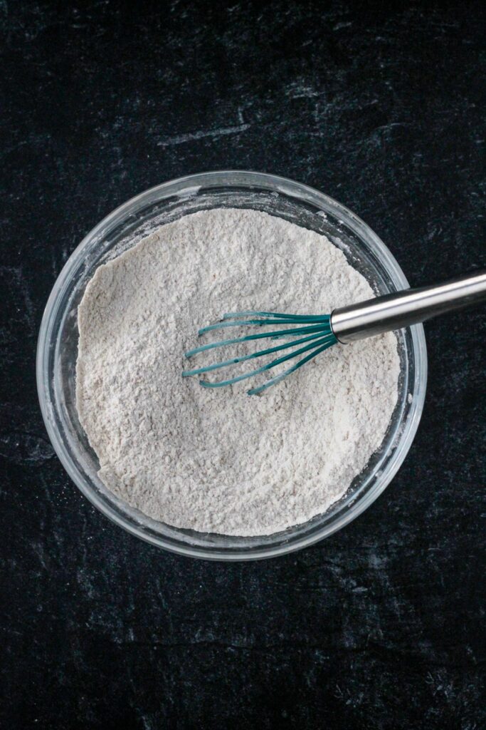 Dry ingredients whisked together in a bowl.