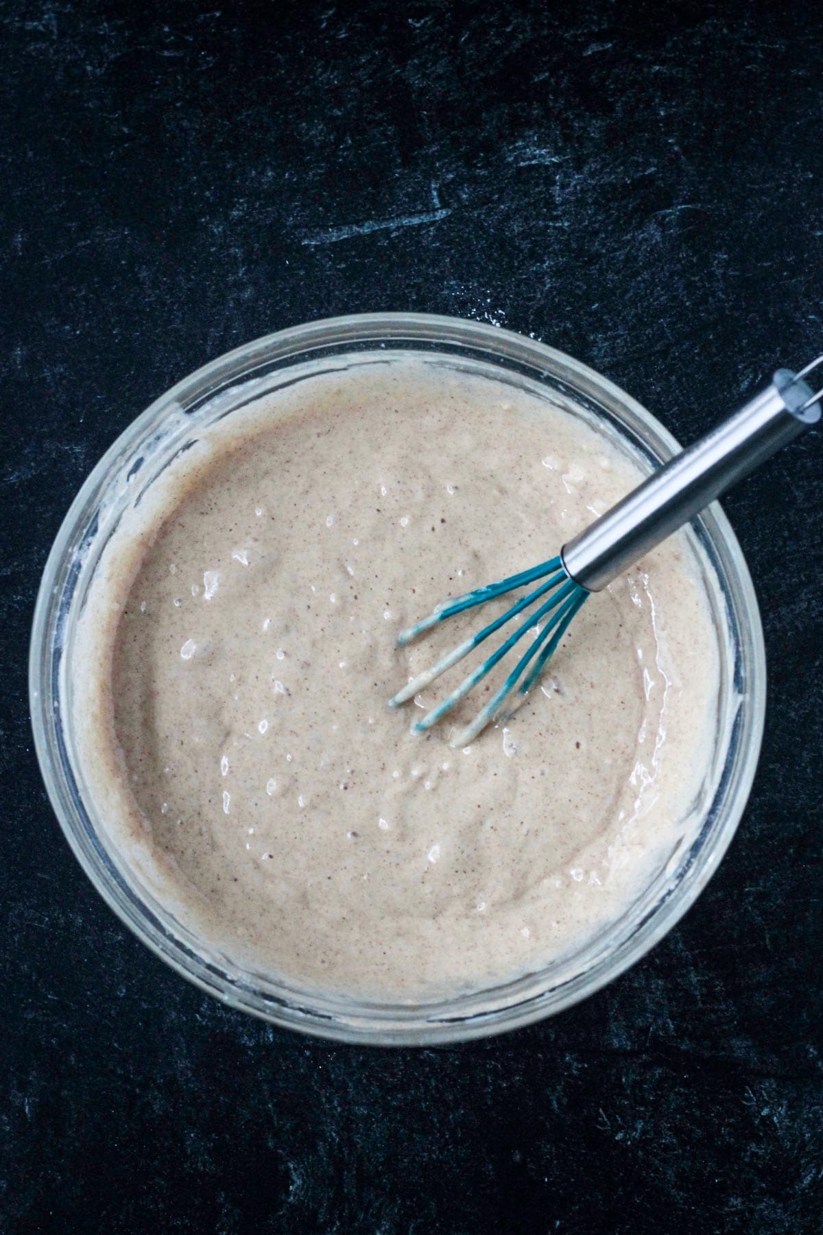 Wet and dry ingredients whisked until smooth in a mixing bowl.