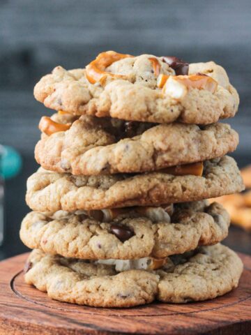 Stack of five vegan chocolate chip cookies with pretzels.