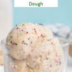 Scoops of edible dough with sprinkles in a glass.