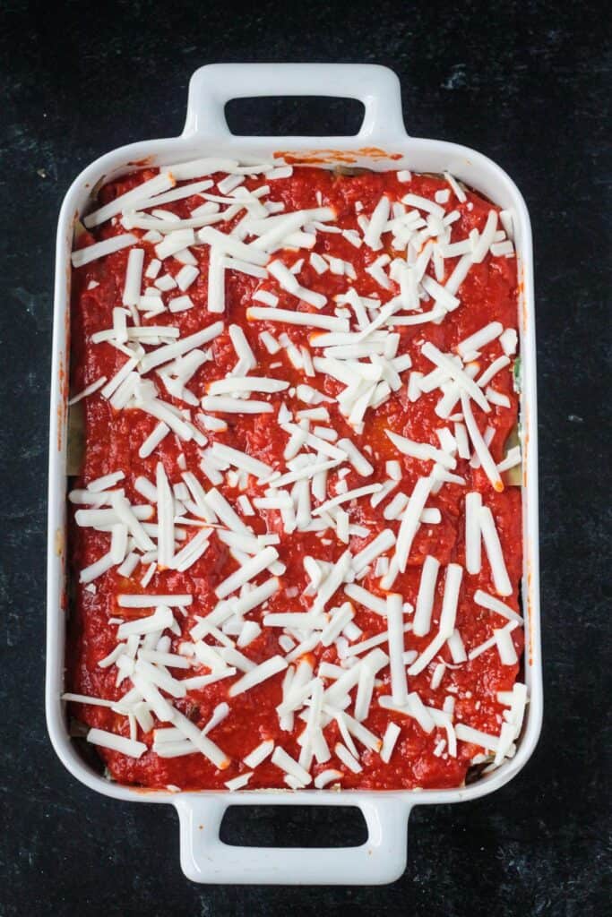 Shredded cheese scattered across the top of the casserole.