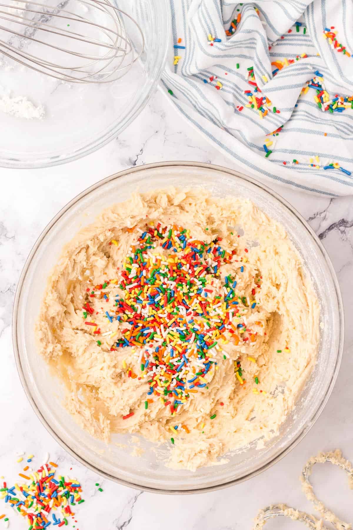 Rainbow sprinkles added to the sugar cookie dough.