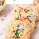 Five funfetti cookies laid out in a row.