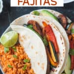 Two vegan fajitas on a plate with Spanish-style rice.