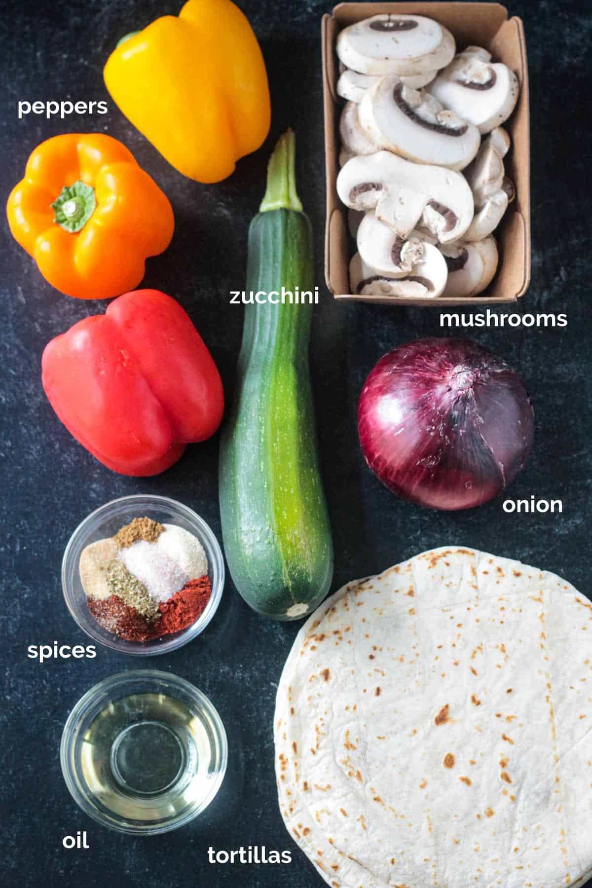 Labeled recipe ingredients arrayed in individual bowls.