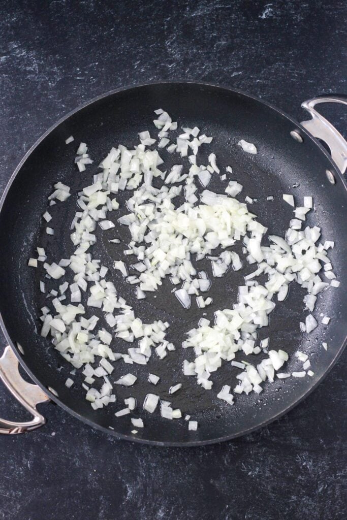 Sautéed diced onions in a large skillet.