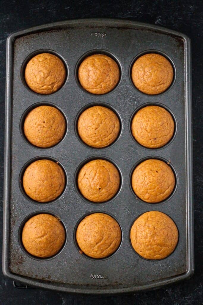 Baked cupcakes in a cupcake pan.
