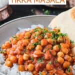 Saucy chickpeas served over rice with a side of torn naan.