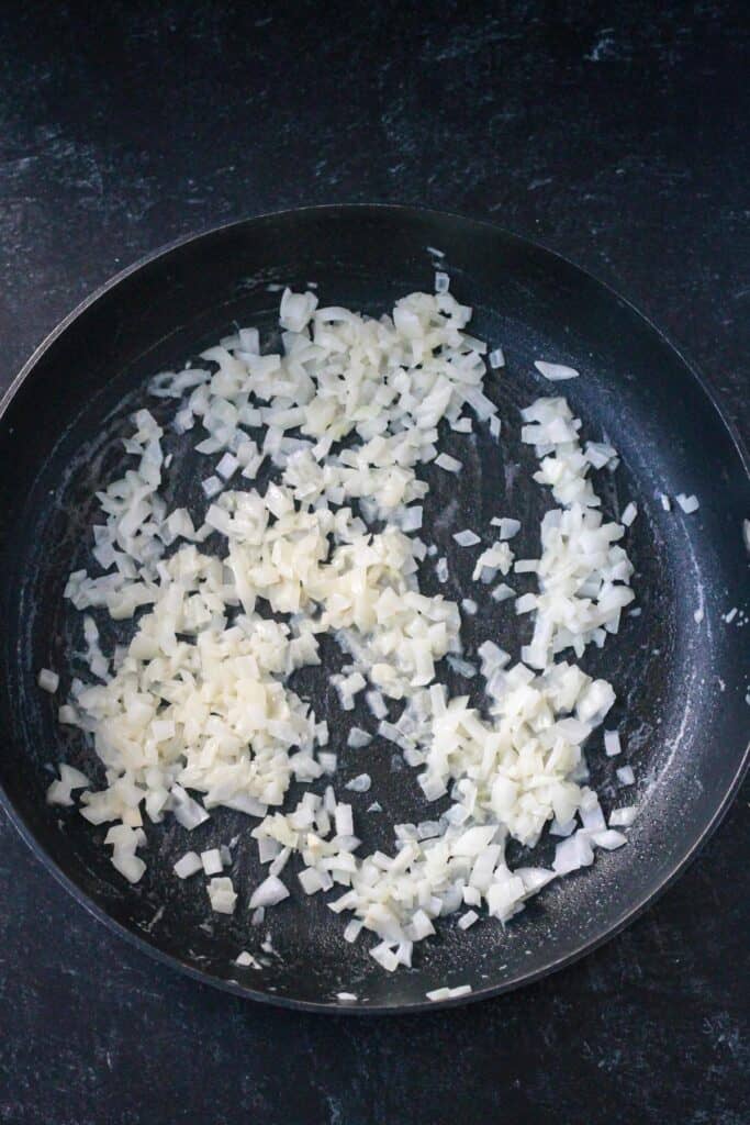 Sautéed onions in a skillet.