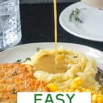 Gravy being poured over a scoop of mashed potatoes.