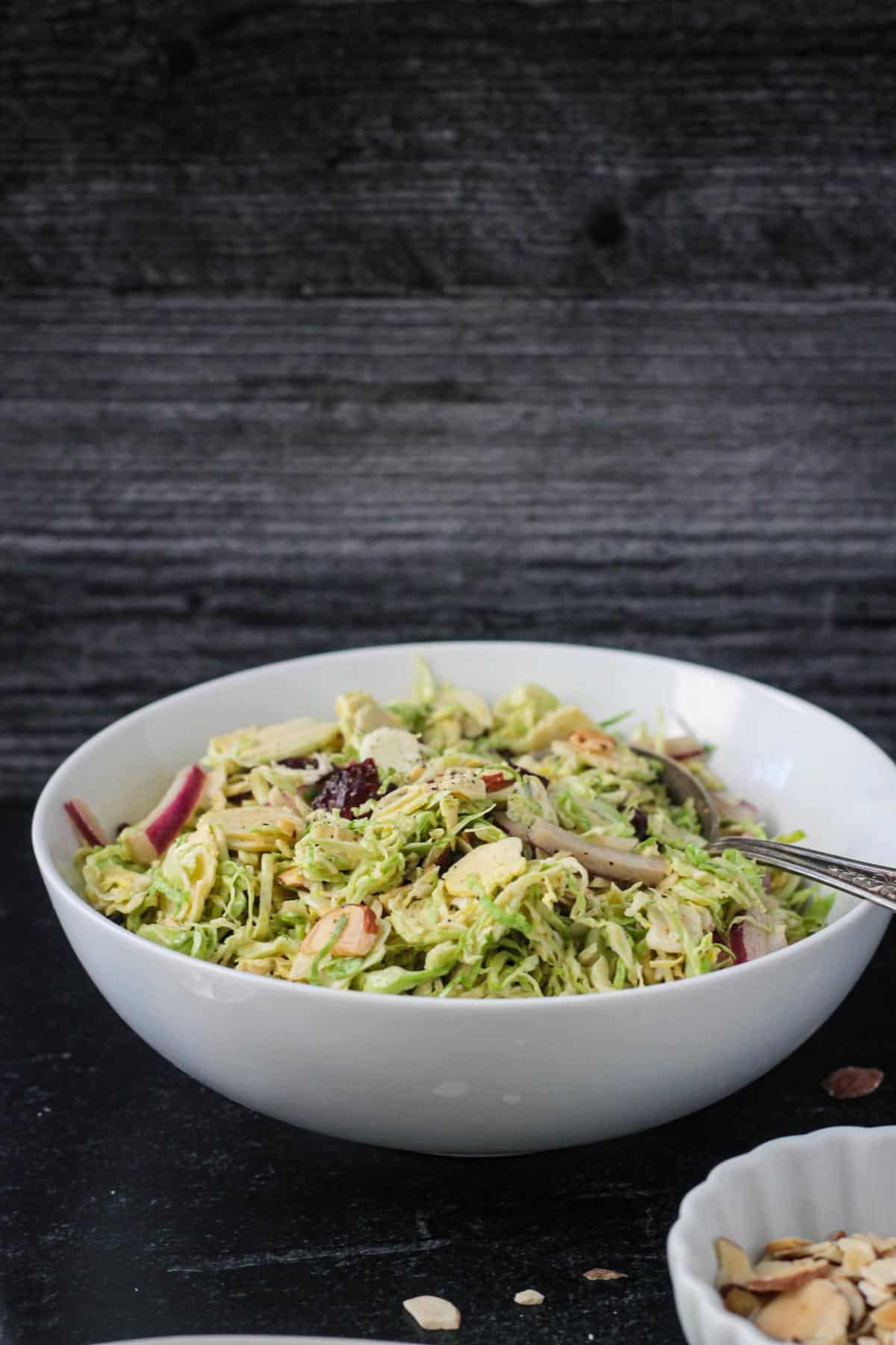 Brussels sprouts salad in a serving bowl.
