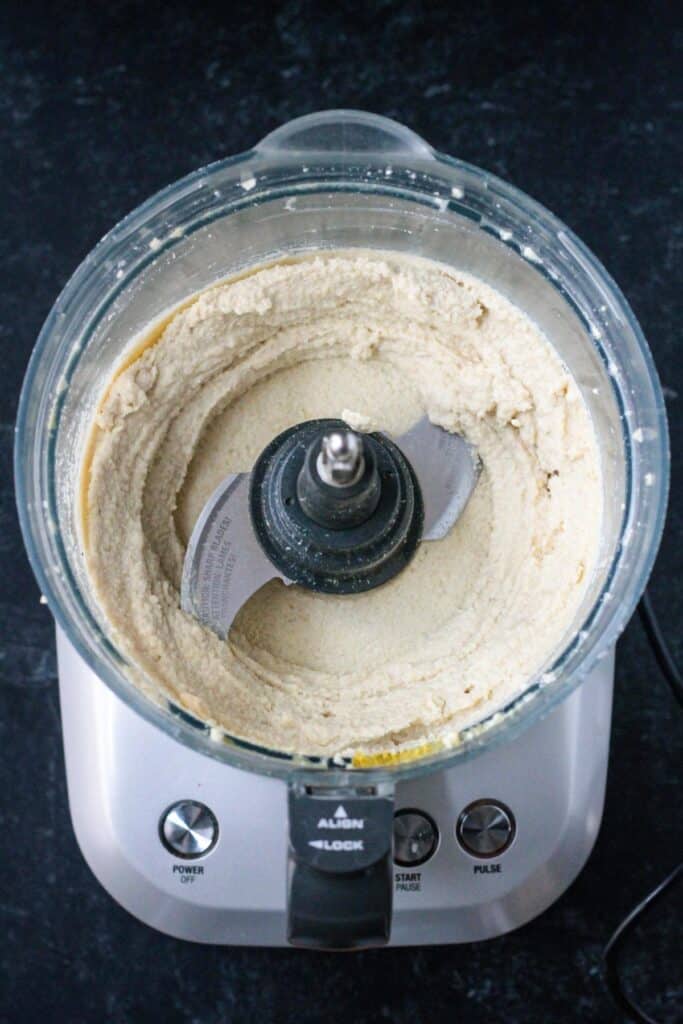 Creamy vegan ricotta spread in a food processor.