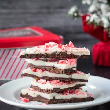 Stack of five pieces of vegan peppermint bark.