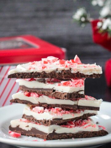 Stack of five pieces of vegan peppermint bark.