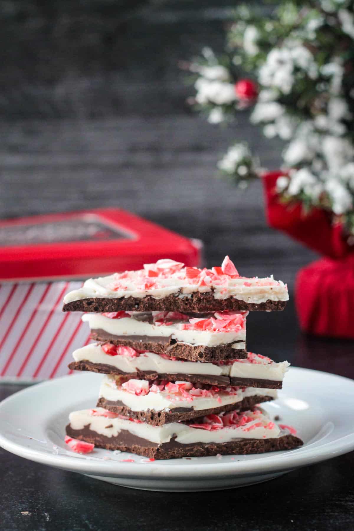 Stack of five pieces of vegan peppermint bark.