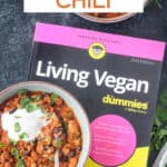 Living Vegan book next to two bowls of chorizo chili.