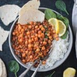 Creamy gochujang chickpeas and lentils on a plate with white rice.