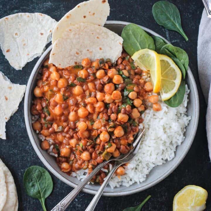 Creamy gochujang chickpeas and lentils on a plate with white rice.