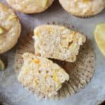 One muffin cut in half on top of a paper cupcake liner.