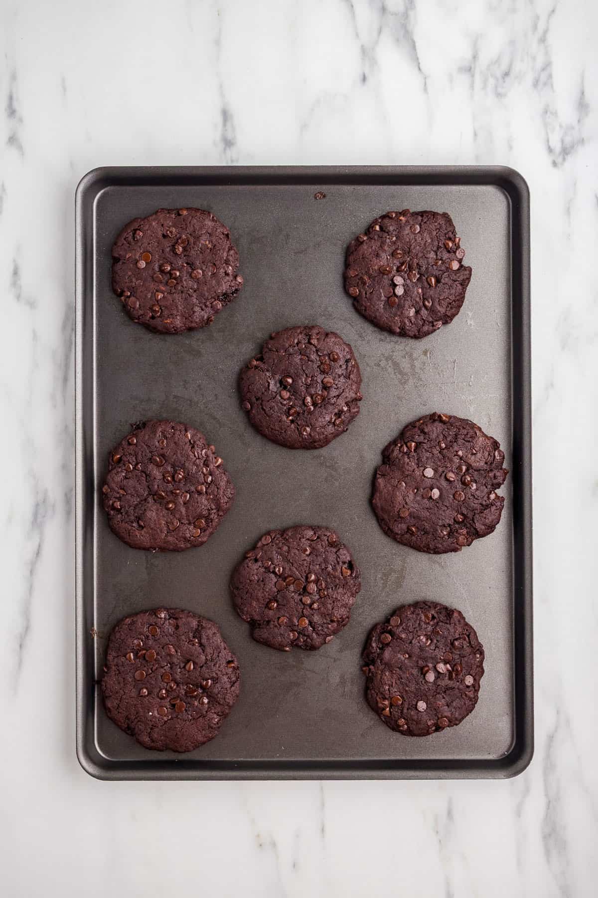Finished baked cookies on a baking sheet.