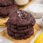 Stack of cookies on a piece of parchment paper.