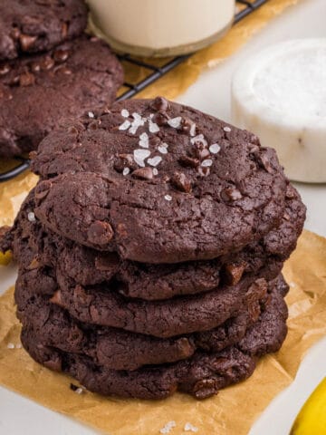 Stack of cookies on a piece of parchment paper.